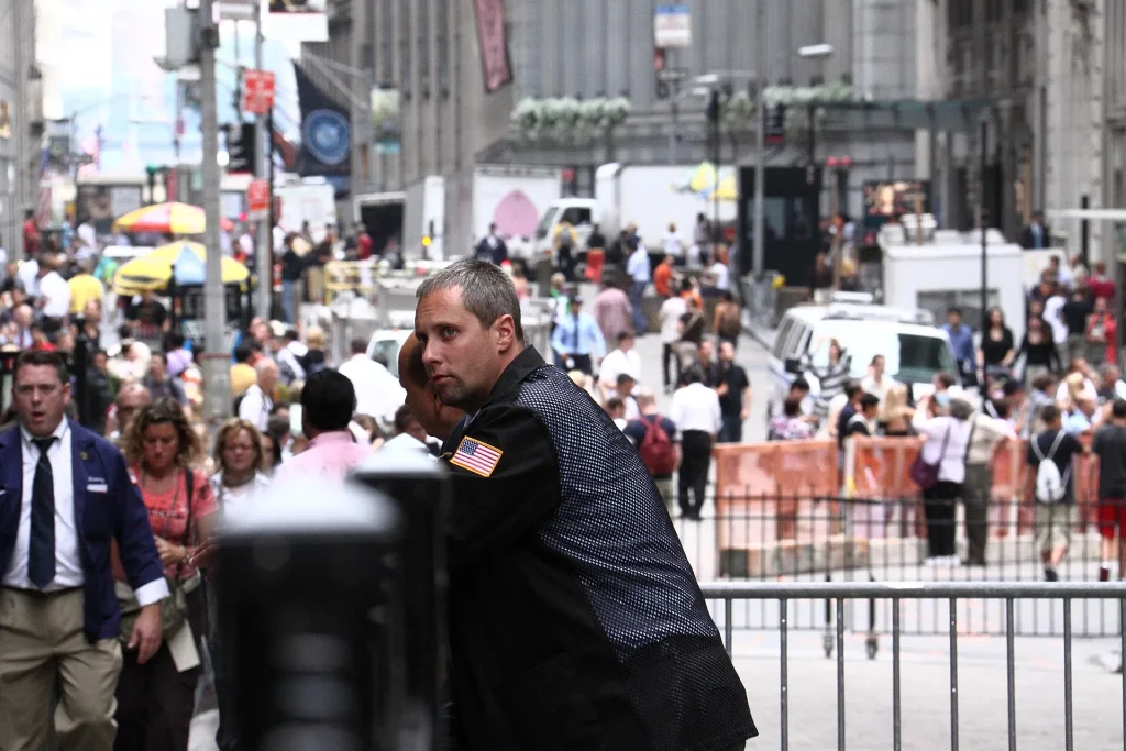 Traders and financial data screens in a busy stock market setting