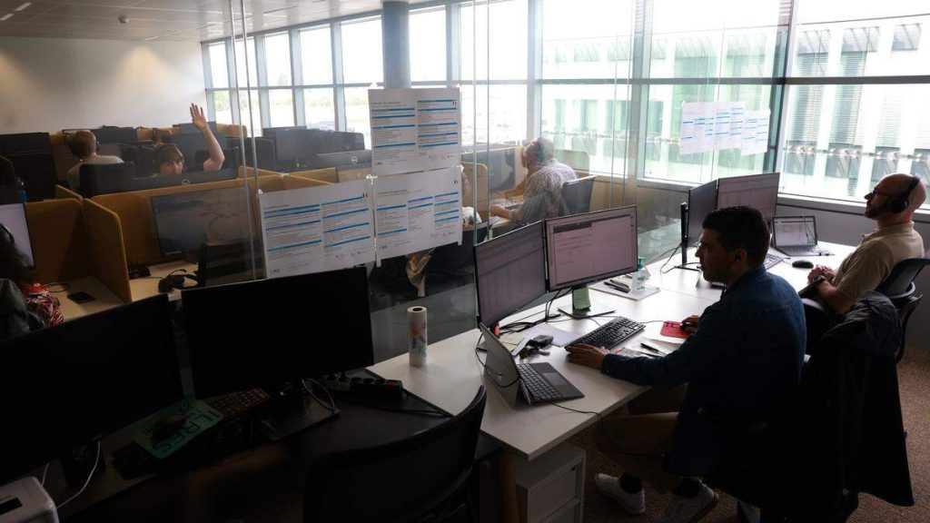Call center team with headsets helping customers
